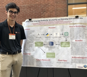 Eric Barton standing next to his SRCC poster